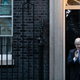 Boris Johnson claps for healthcare workers and other key employees in the covid-19 pandemic on April 30, 2020 in front of 10 Downing Street.